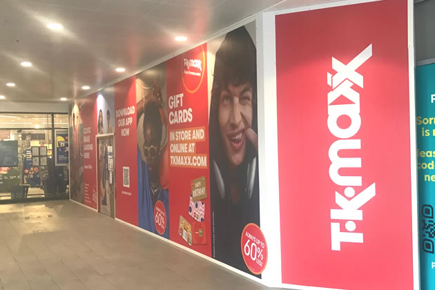 The blank white hoardings have now been replaced with TK Maxx branding 
