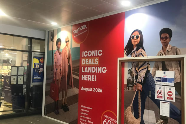 The hoarding promises an opening next month 