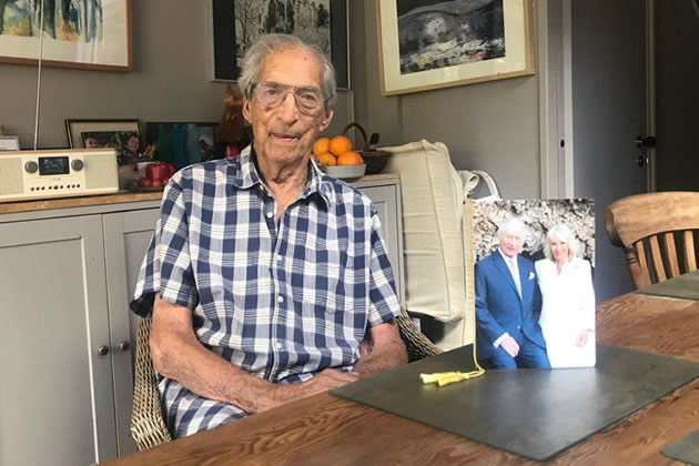 Denis Browne with the card he received from the King and Queen 