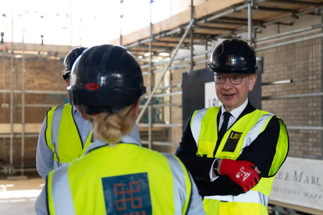 Michael Gove at the construction site in Brentford