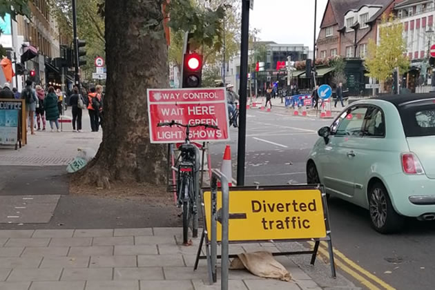 Diversion sign points drivers towards Turnham Green Terrace 