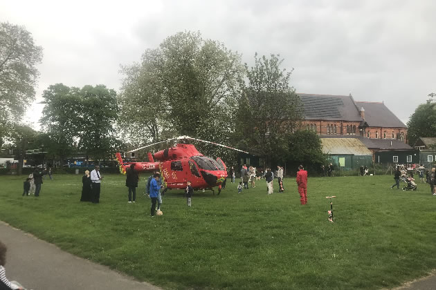 People in the park get a close view of the Air Ambulance 