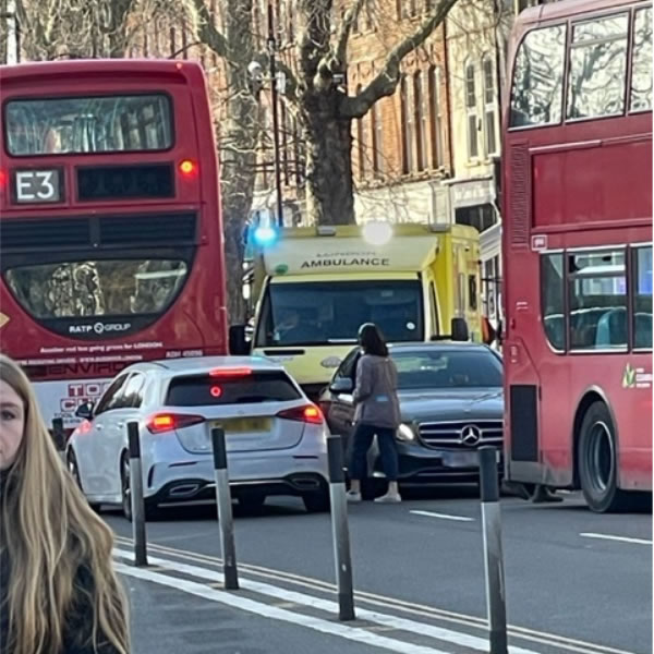 The ambulance struggles to move through traffic on Chiswick High Road