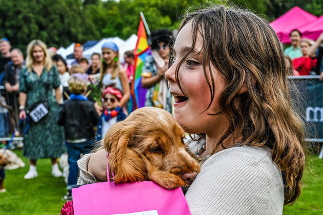 Best in show winner Little Chief, accompanied by his owner, 10 year-old Ralphine