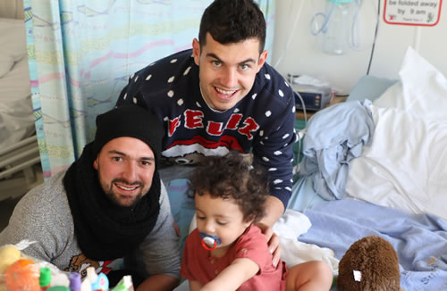 two brentford footballers pictured with sick child during hospital visit 