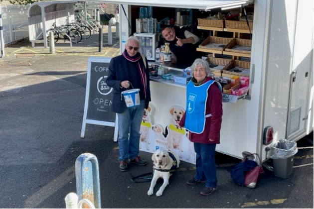 Collecting funds in front of the coffee stand by Chiswick Station 