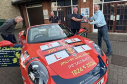 Couple Driving Porsche to Every RNLI Station Reaches Chiswick