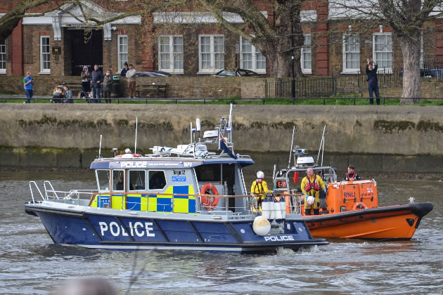 A Marine Police boat with the Chiswick Lifeboat near Strand on the Green during the search