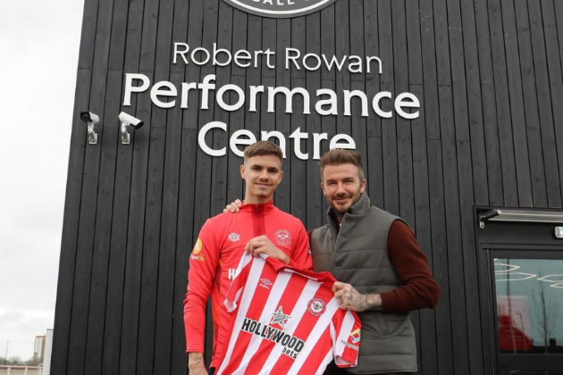 Romeo Beckham (left) with his dad at Brentford's training centre 