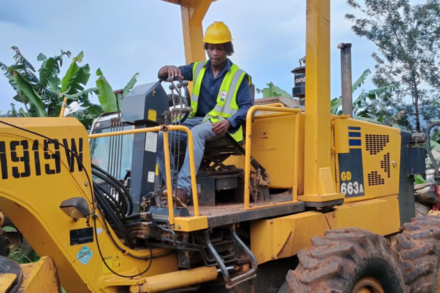 Cllr Mushiso on a construction vehicle