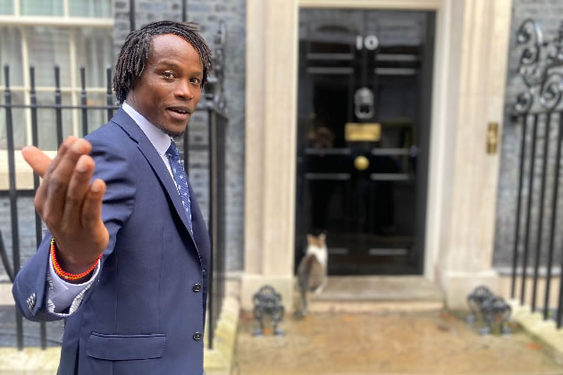 Cllr Mushiso outside 10 Downing Street with Larry the Cat 