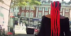 woman with long red dreadlocks walks back to her car after shouting at jeremy vine 