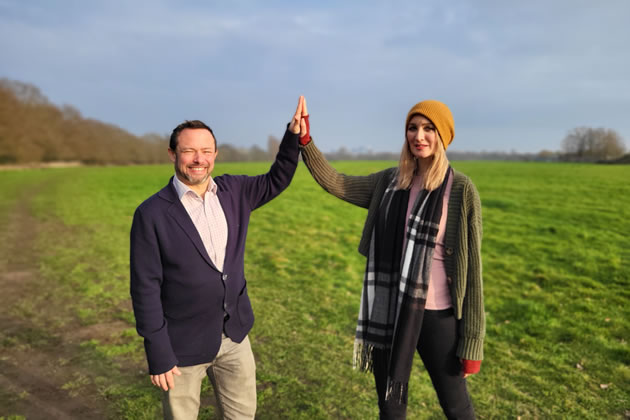 Cllr Gary Malcolm high-fiving with Katie Boyles