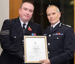 Police Sergeant John Harrison is presented with a Livia Award