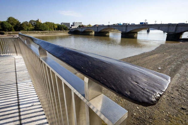 Bronze oars form the handrails of the balustrade