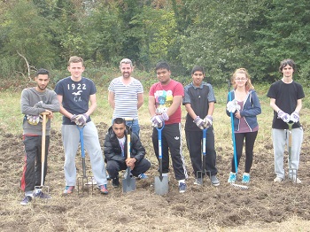 Volunteers with spades and forks