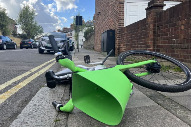 A Lime e-bike blocking the pavement in Langthorne Street, Fulham