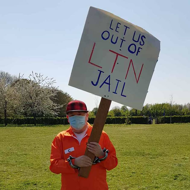 One protestor dress in an orange jump suit to make his point. Picture: Mike Hughes