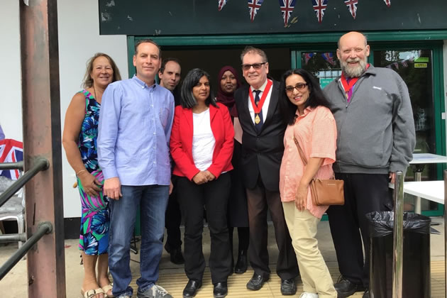 Rupa celebrates alongside the Pavilion Cafe's new owner Yahya, the local councillors and former mayors of Ealing