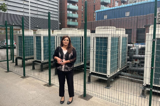 Cllr Samia Chaudhary with heat pumps installed by the council