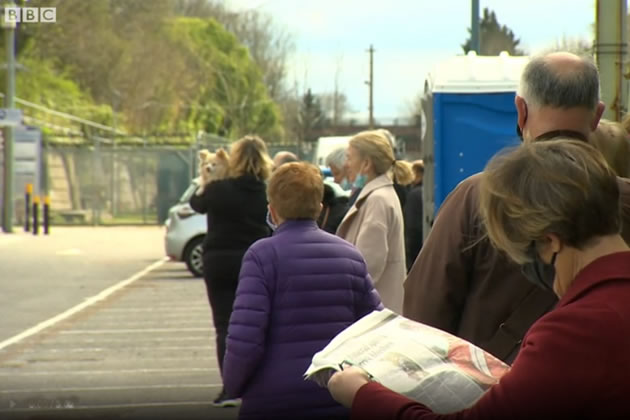 People in area with Indian variant queuing for surge testing 