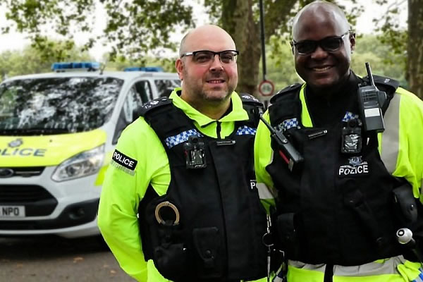 Sergeant Sunnee Arhagba (right) on duty with a colleague